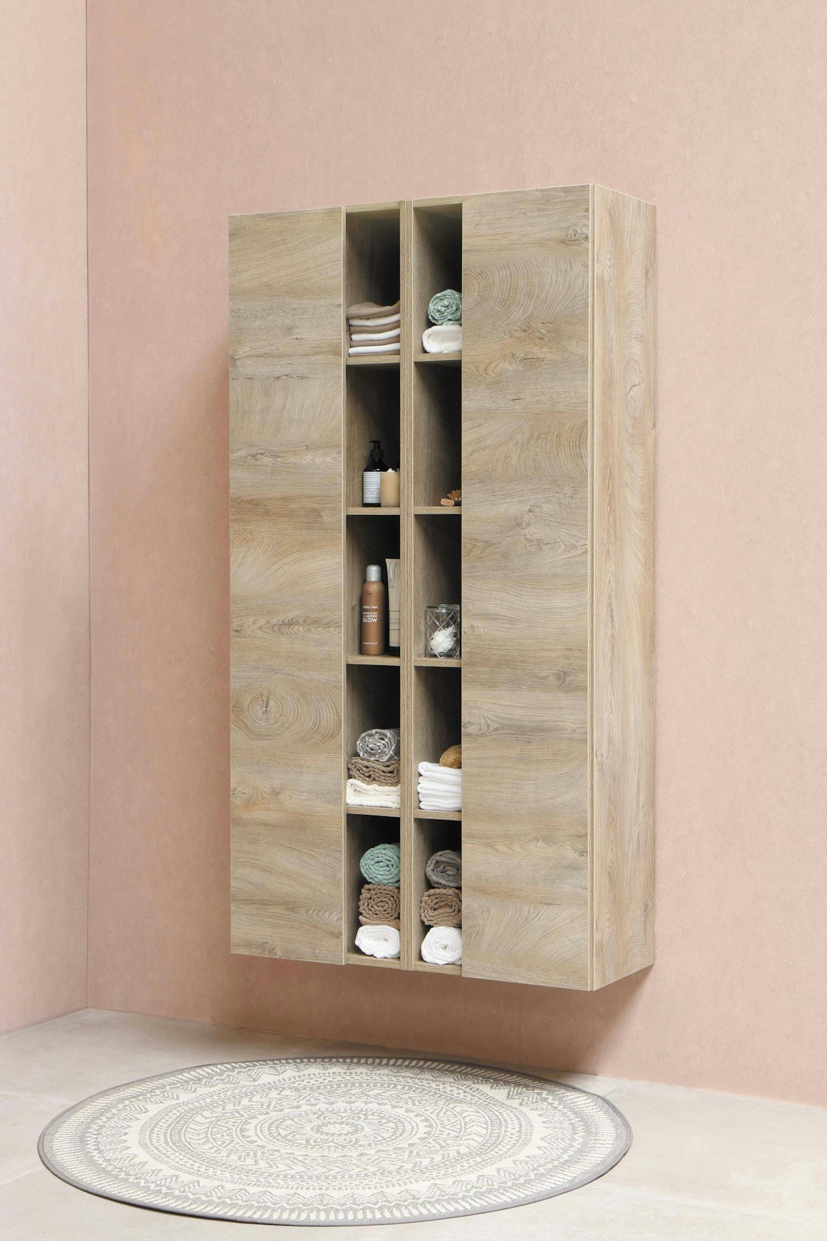 Wooden wall shelf with bottles on top