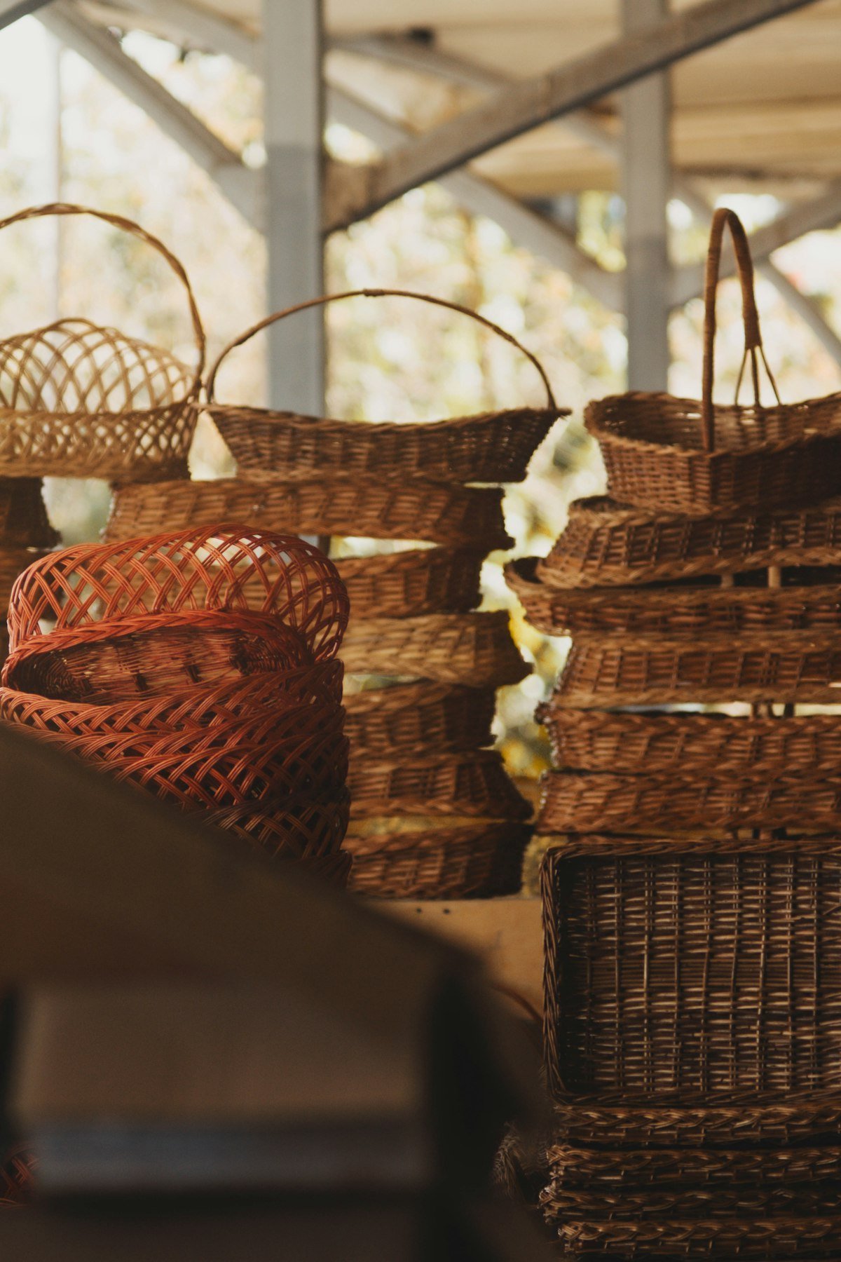 Natural fibre woven baskets on a shelf